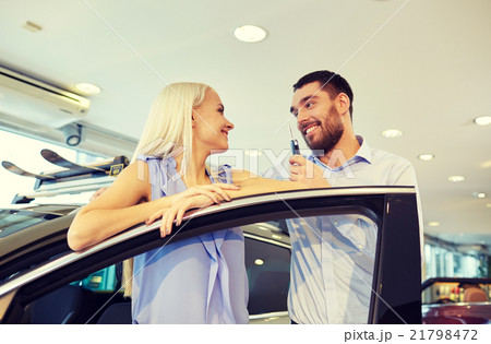 happy couple buying car in auto show or salon happy couple buying car in auto show or salon 21798472