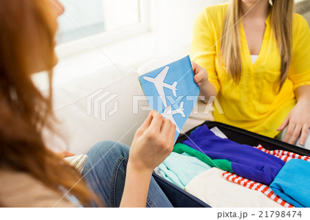 close up of women with tickets and travel bag 21798474