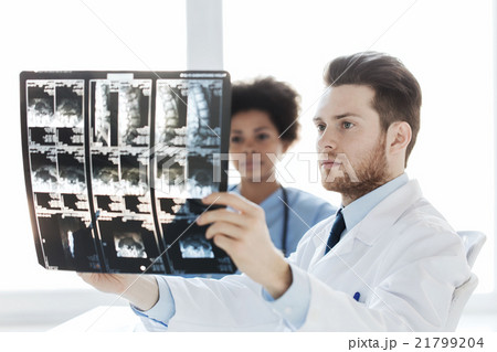 doctor and nurse looking to x-ray at hospital doctor and nurse looking to x-ray at hospital 21799204