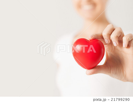 happy woman with small red heart happy woman with small red heart 21799290