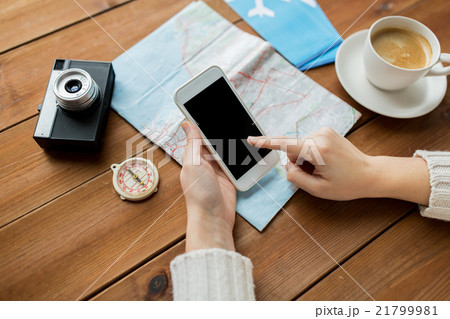 close up of traveler hands with smartphone and map close up of traveler hands with smartphone and map 21799981