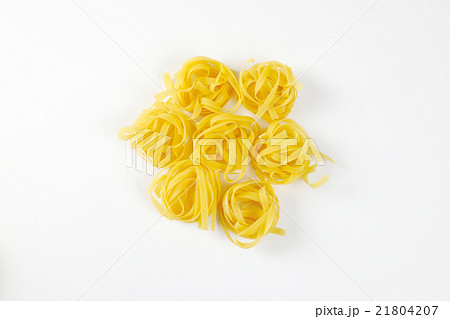 Nests of dry pasta tagliatelle 21804207