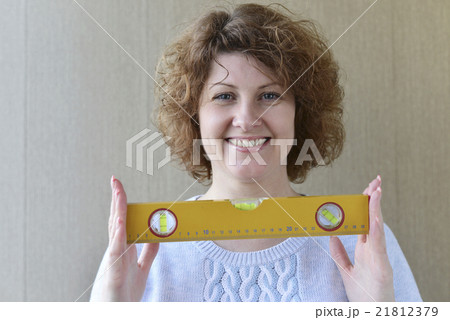 woman is holding construction tools 21812379