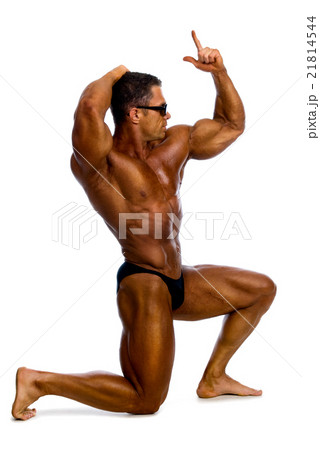 bodybuilder showing his muscles bodybuilder showing his muscles 21814544