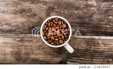 Coffee beans in a cup 21820057