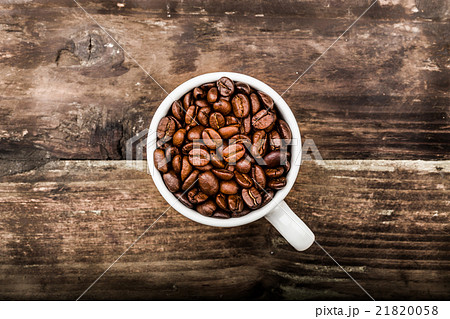 Coffee beans in a cup 21820058