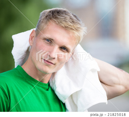 Tired man after fitness time and exercising. With Tired man after fitness time and exercising. With 21825018