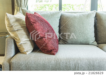 living room with row of pillows on sofa at home 21826629