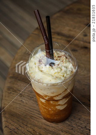 Iced coffee smoothie on wood background 21831635