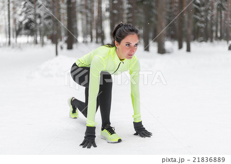 Sportive athlete woman sprinter ready to run 21836889