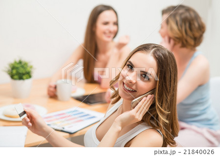 Cheerful girl talking on mobile phone  21840026