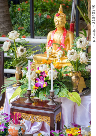 Buddha statue wet water with flower. 21840540