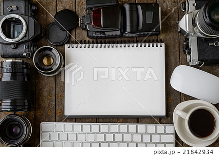 Old cameras and blank paper on wooden table,flat Old cameras and blank paper on wooden table,flat 21842934