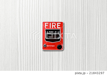 Fire alarm switch on white wood background Fire alarm switch on white wood background 21843297