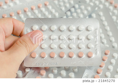 woman hand holding contraceptive pills woman hand holding contraceptive pills 21845270