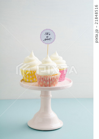 Three baby shower cupcakes 21848516