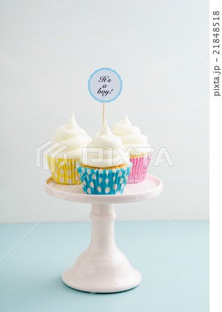 Three baby shower cupcakes 21848518