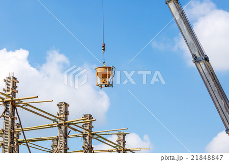 Crane working in construction on blue sky Crane working in construction on blue sky 21848847