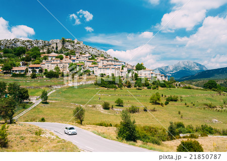 Car Goes On Road Near Medieval Hilltop Village Of Car Goes On Road Near Medieval Hilltop Village Of 21850787