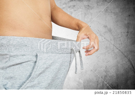 Asian guy pulling warm pant, abstract concept 21850835