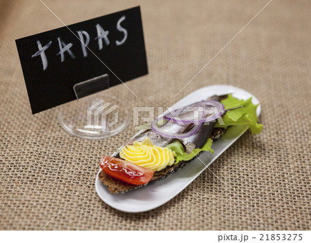 Delicious Spanish tapas with butter onion salad Delicious Spanish tapas with butter onion salad 21853275
