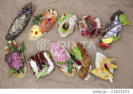 Set of Spanish tapas on the textiles background Set of Spanish tapas on the textiles background 21853291