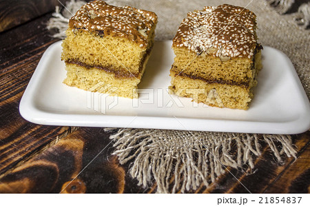 Plate with sliced biscuit cakes 21854837