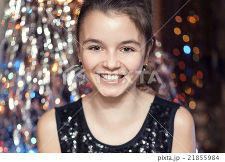 Young beautiful girl smiling and holding a 21855984