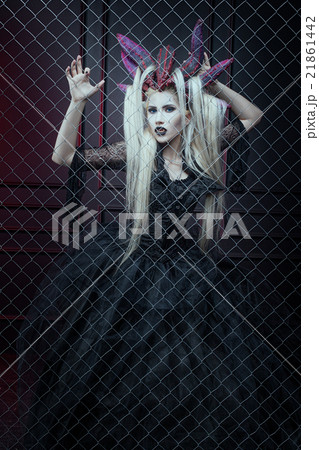 Woman in a cage. 21861442