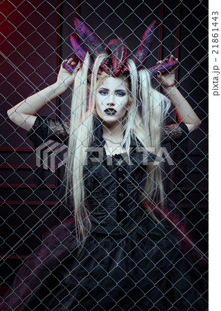 Woman behind a lattice. 21861443