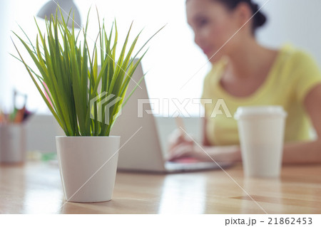 Cute female worker is typing on computer 21862453