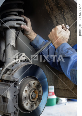 mechanic fixes brakes mechanic fixes brakes 21863377