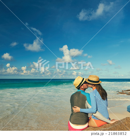 Couple at tropical beach wearing rash guard Couple at tropical beach wearing rash guard 21863852