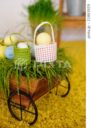 Easter eggs and colorful decor trolley in studio Easter eggs and colorful decor trolley in studio 21863929