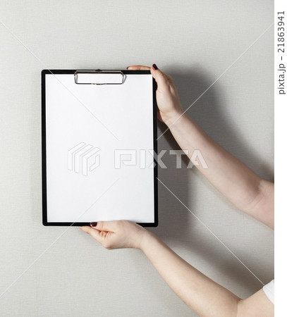 Clipboard in female hands 21863941