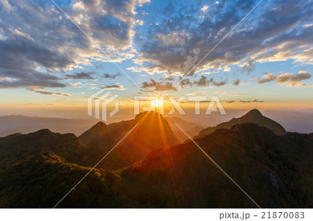 Layer of mountains and mist at sunset time Layer of mountains and mist at sunset time 21870083