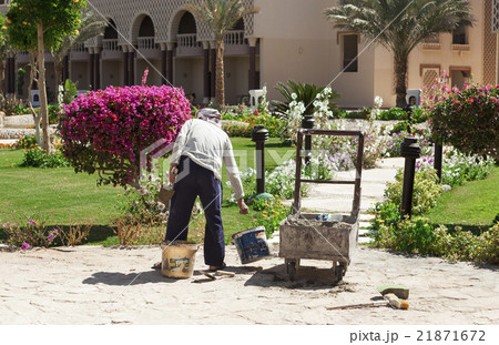 The builder, gardener is working on  repair tracks 21871672