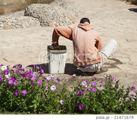 The builder, gardener is working The builder, gardener is working 21871679