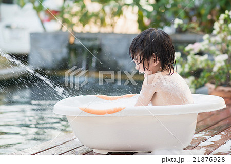 Cute asian child bathing in the garden Cute asian child bathing in the garden 21876928