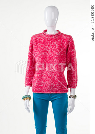 Turquoise pants and pink sweatshirt. 21880980
