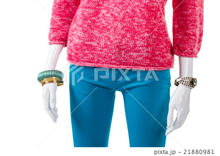 Turquoise trousers with pink pullover. 21880981
