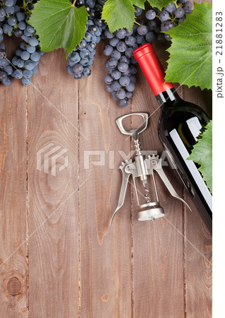 Red grape, wine bottle and corkscrew Red grape, wine bottle and corkscrew 21881283