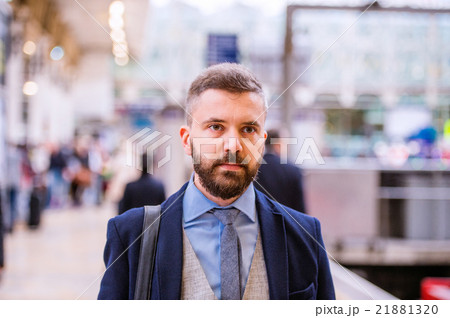 Close up, hipster businessman waiting at the train 21881320