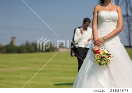 Beautiful bride with bouquet of flowers Beautiful bride with bouquet of flowers 21882373