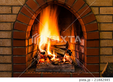 tongues of fire in indoor brick fireplace tongues of fire in indoor brick fireplace 21882985