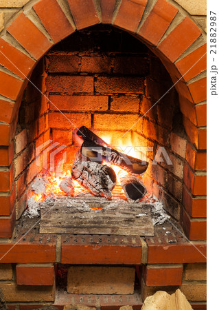 ash, coal and burning billets in fireplace ash, coal and burning billets in fireplace 21882987