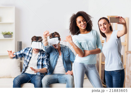 Positive guys using virtual reality device Positive guys using virtual reality device 21883605