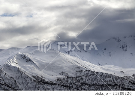Evening sunlight mountains and gray cloudy sky 21889226