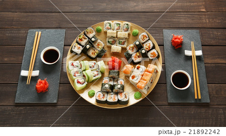 Set of sushi maki and rolls at black rustic wood. 21892242