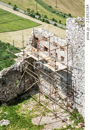 Plavecky castle in Slovakia, ruins with scaffolding, travel dest 21892384